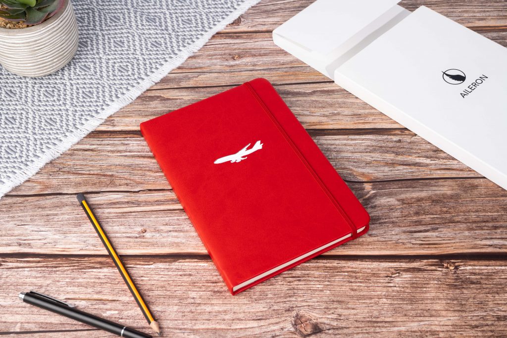 Lifestyle creative photo of a lather notebook