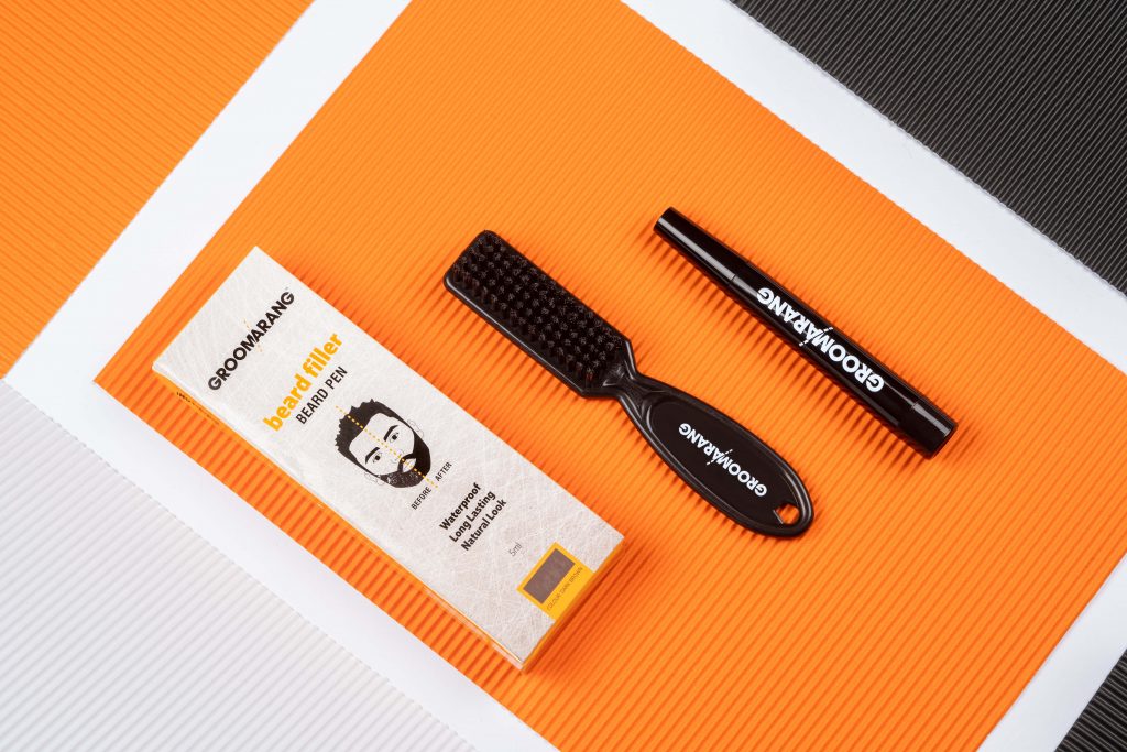 Creative product photo of a Beard filler Pen and Beard brush kit